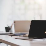 Open,Blank,Laptop,In,Modern,Workplace,With,Office,Supplies,And